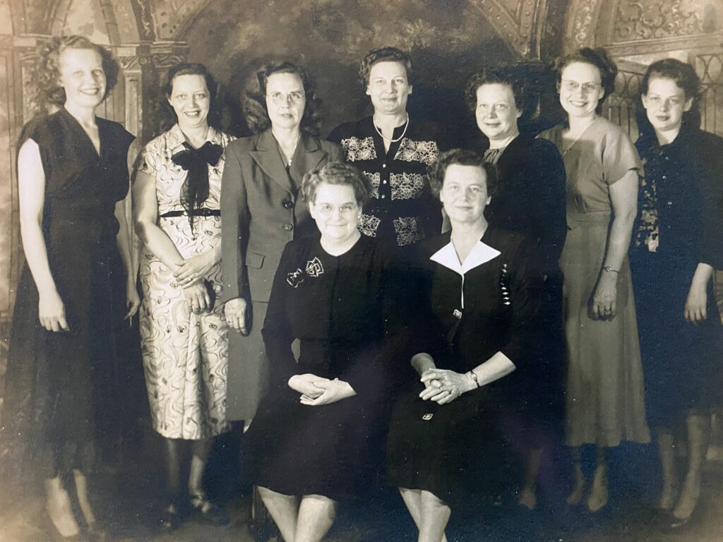 Leona Deming Green Bratton and eight of her nine daughters. 
Leona is in the front row on the left. 
The only daughter I recognize with 100% certainty is my grandmother, Gertrude Bratton Bennett, 
in the back row, third from the right.